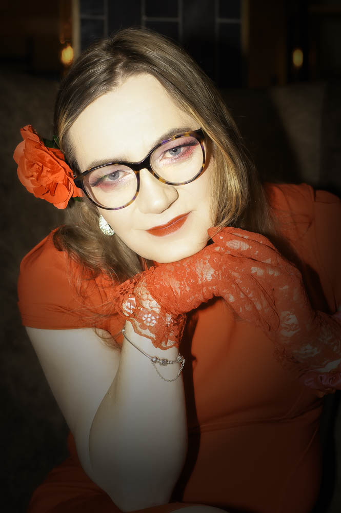 Headshot of Annabelle in a red dress at the hotel