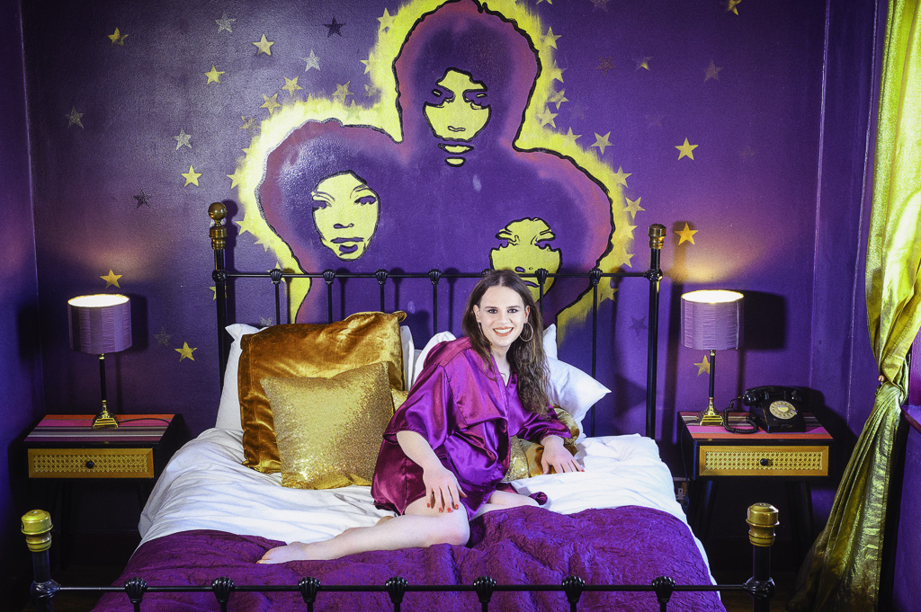 Jessica on bed - purple theme