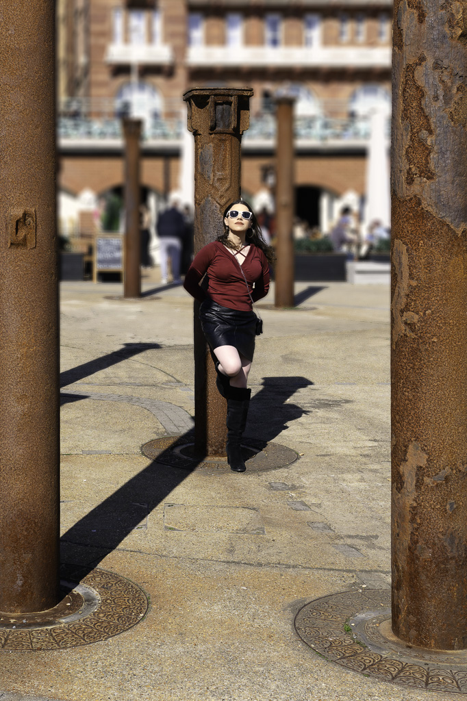 Jessica leaning against pillar outside