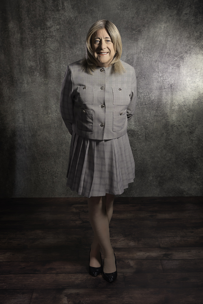 Nicola in grey two-piece suit