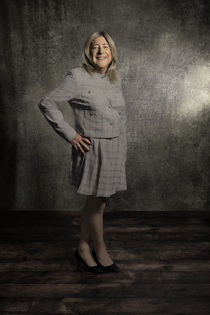 Nicola in grey two-piece suit