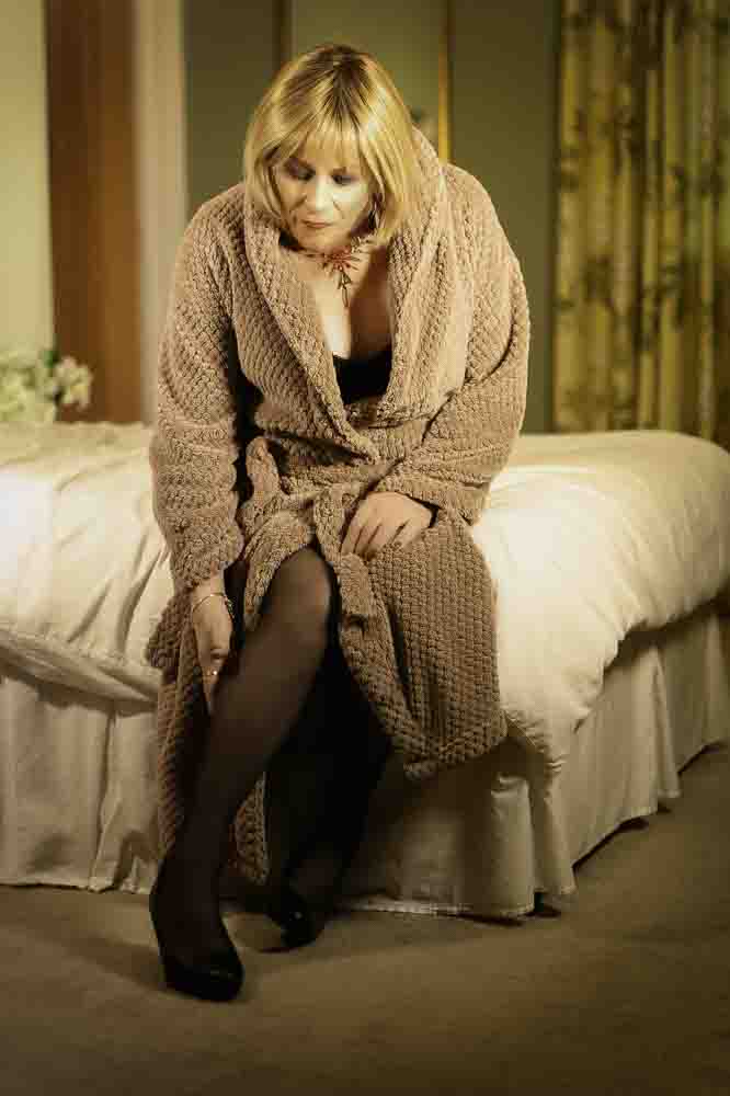 Stella is dressing gown on bed