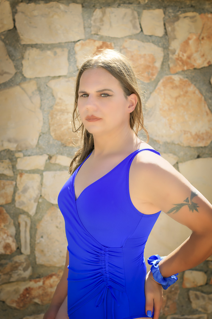 Jessica in a blue swimsuit against a cream coloured wall, Zakynthos