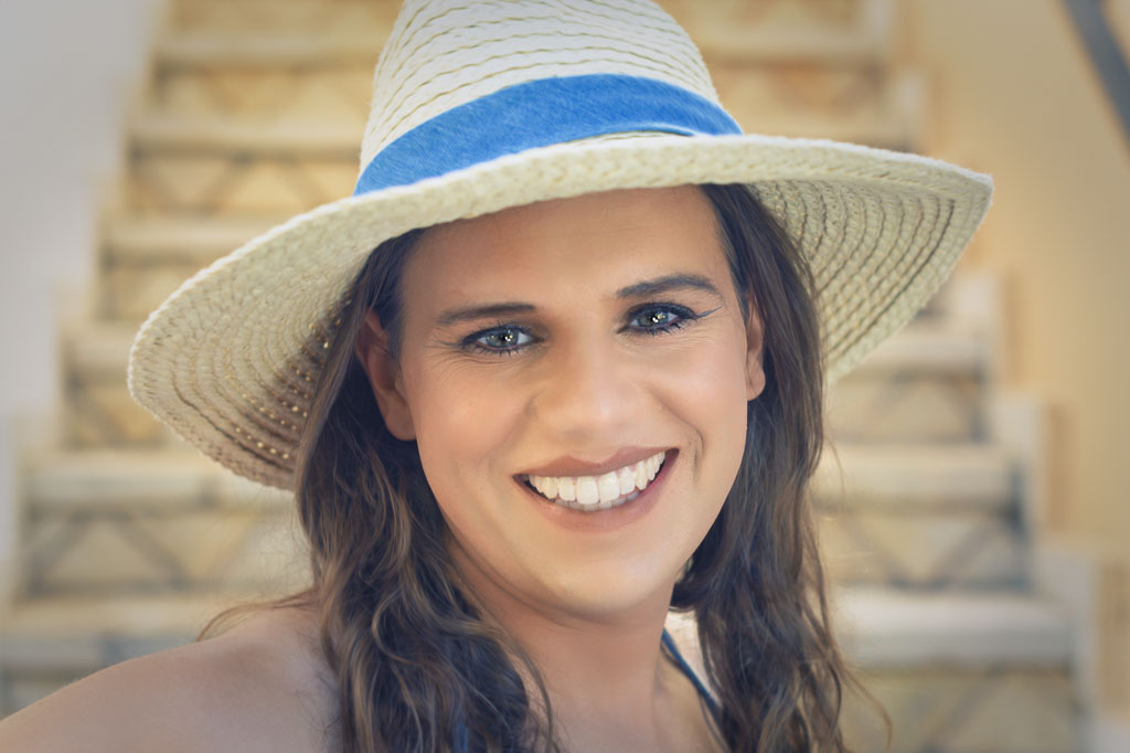Close up headshot of Jessica with a sunhat on, Zakynthos